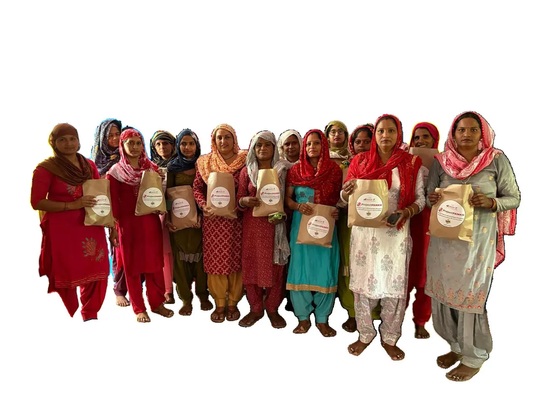 Women holding menstrual hygiene kits distributed under Project Pankh